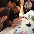 professor-larry-berman-signs-copies-of-the-new-edition-of-his-book-about-legendary-spy-pham-xuan-an-for-delegates-and-readers-during-the-book-launch-in-hanoi-photo-vov-1444075-anh-1-512×384